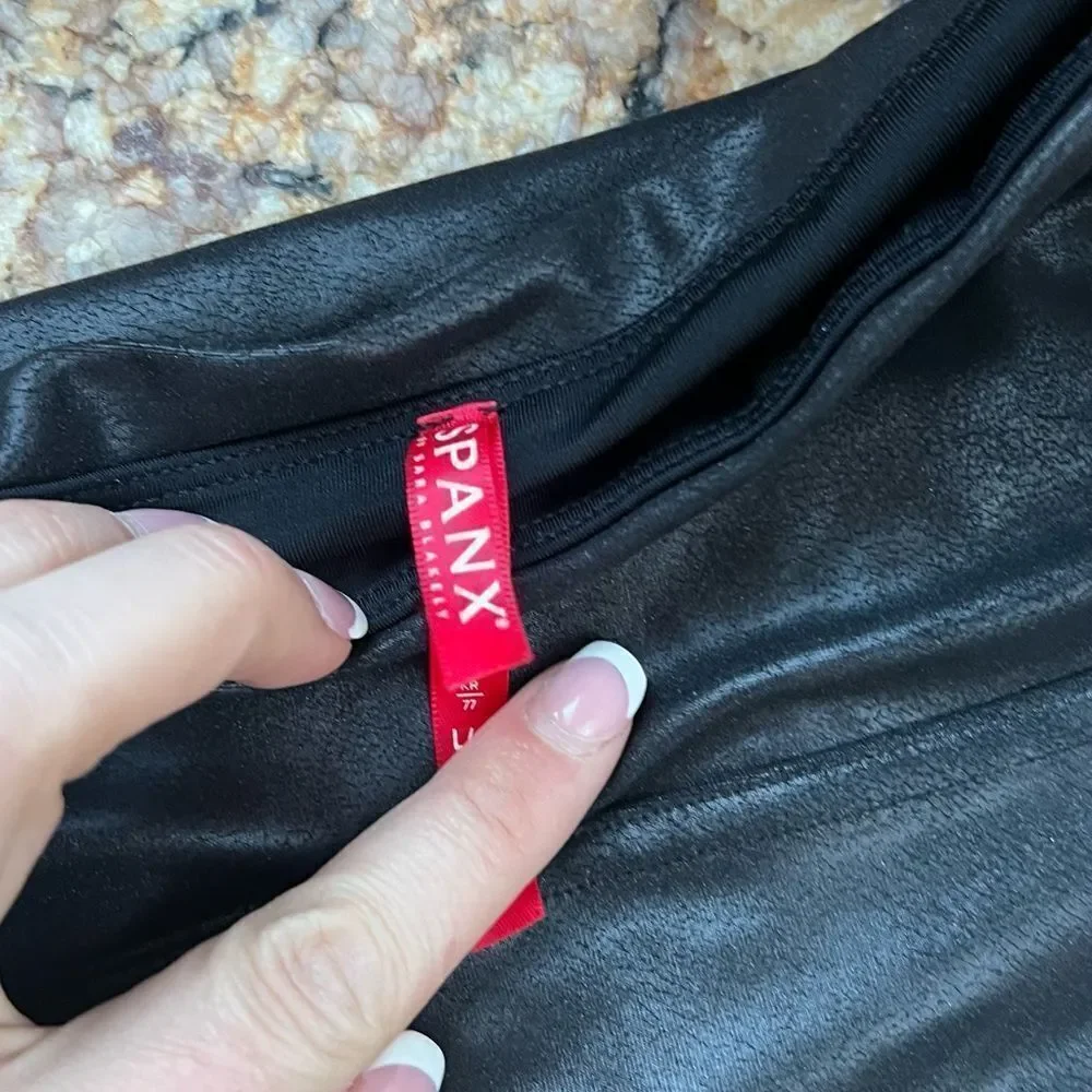 2 Spanx Black and Camouflage Leggings